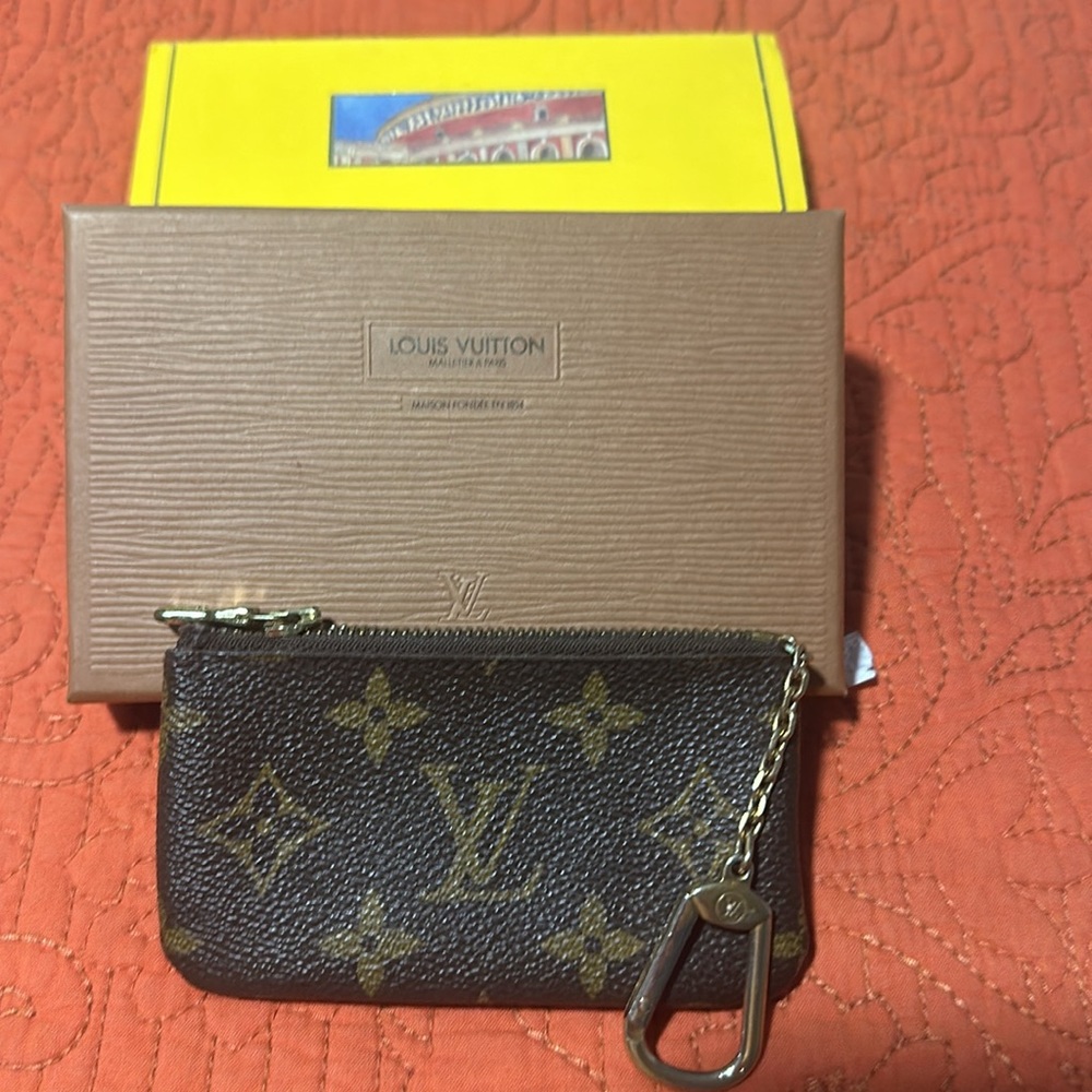 Louis Vuitton coin purse with key ring.